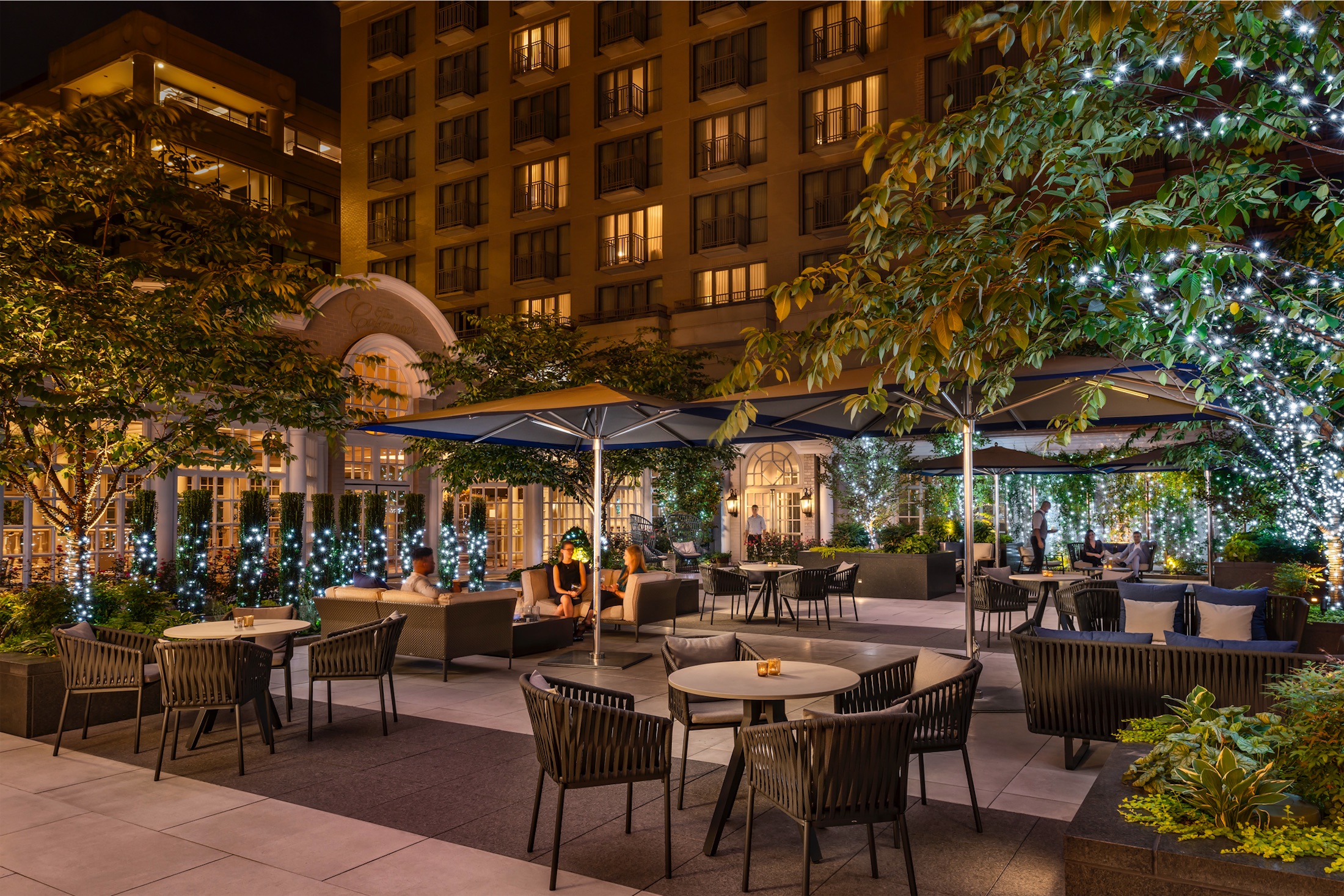 The outdoor dining patio of Fairmont Washington Hotel's restaurant at night.