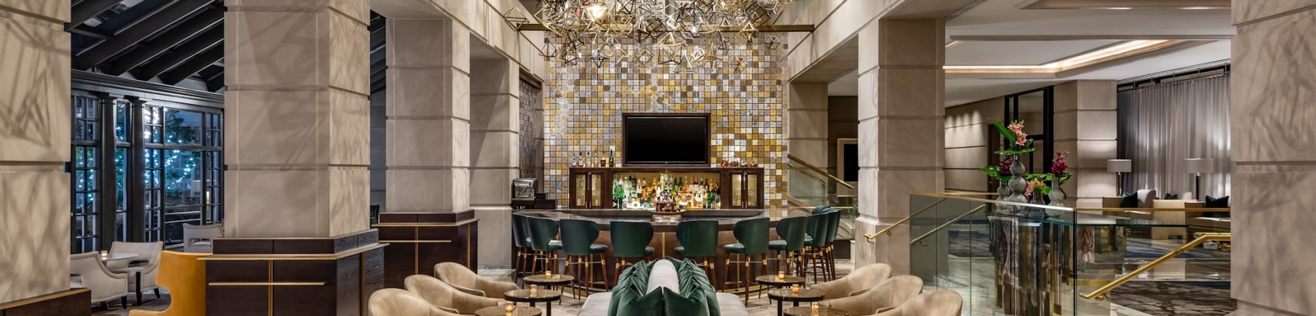 large, marble room with chairs and a bar