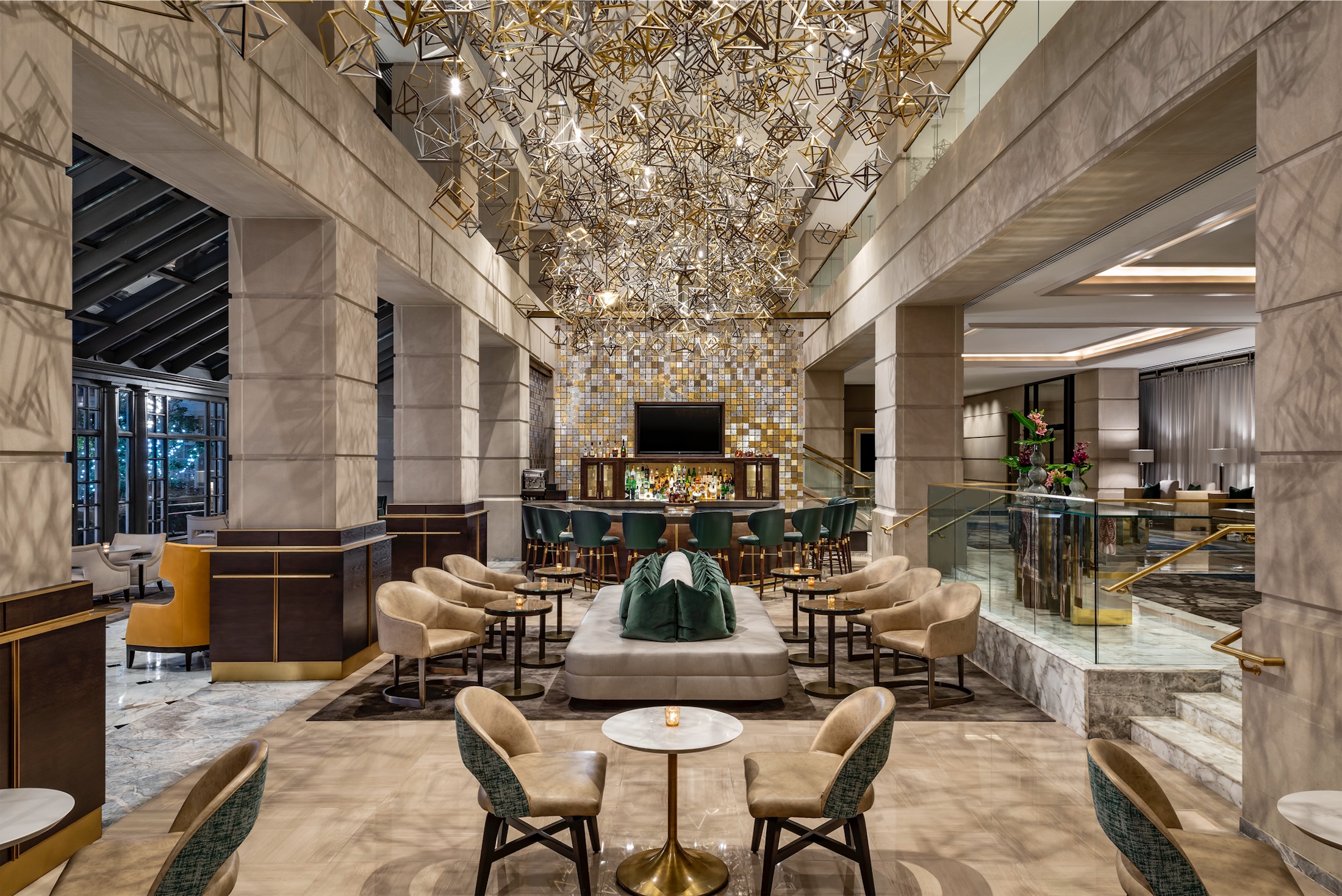 large, marble room with chairs and a bar