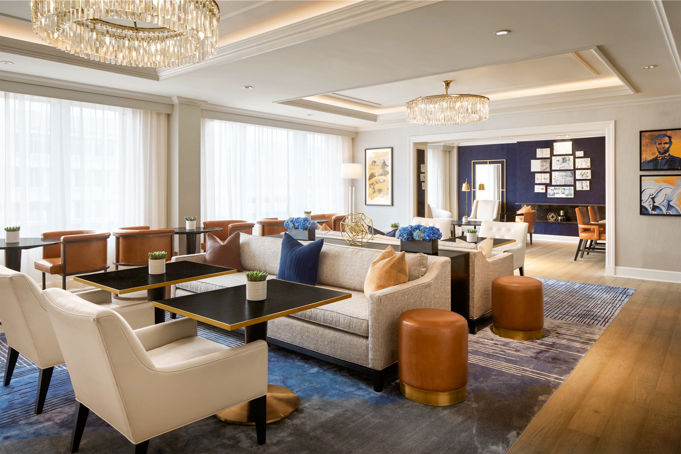 well lit lounge with with sofas and chairs