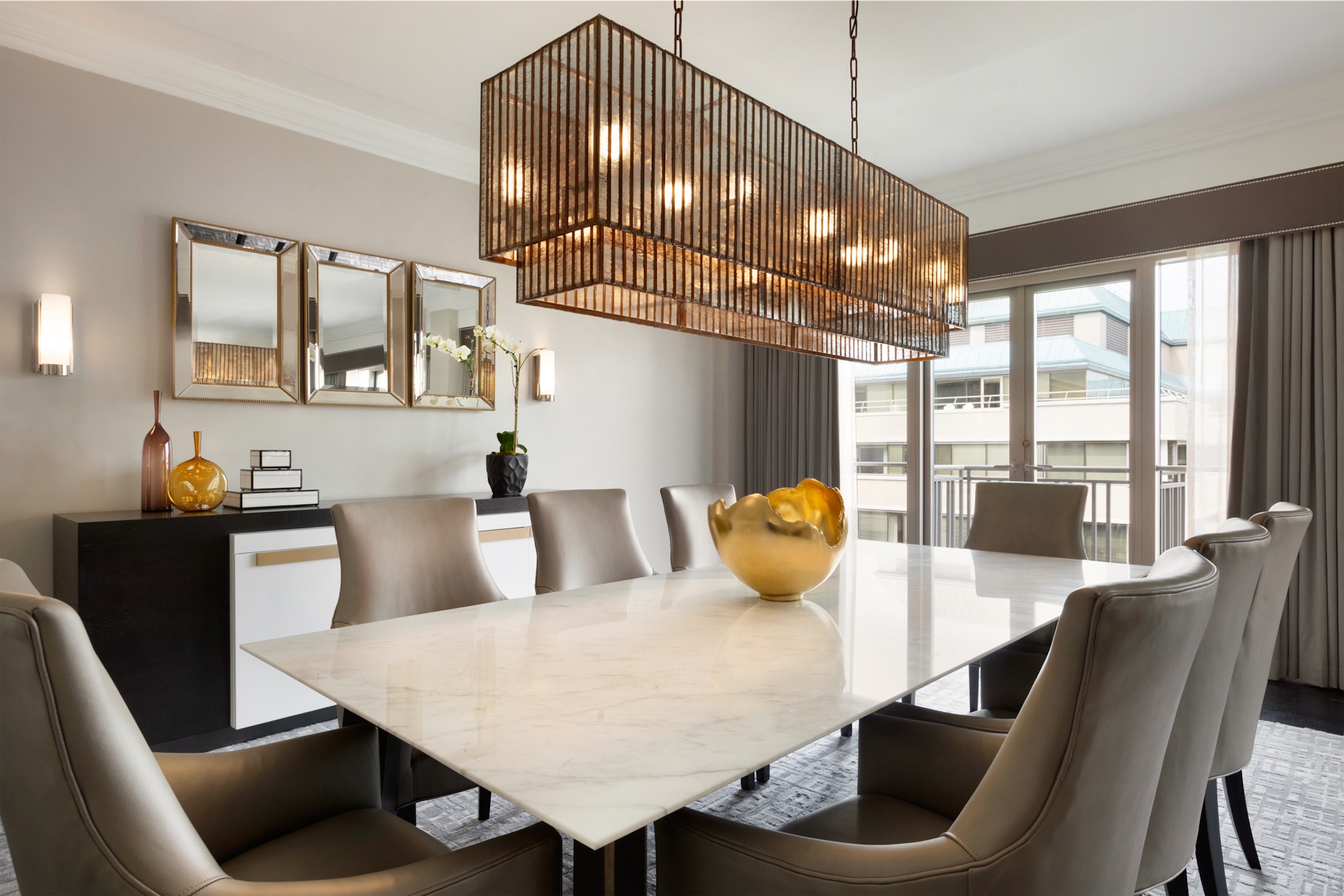 dining table surrounded by cushioned chairs