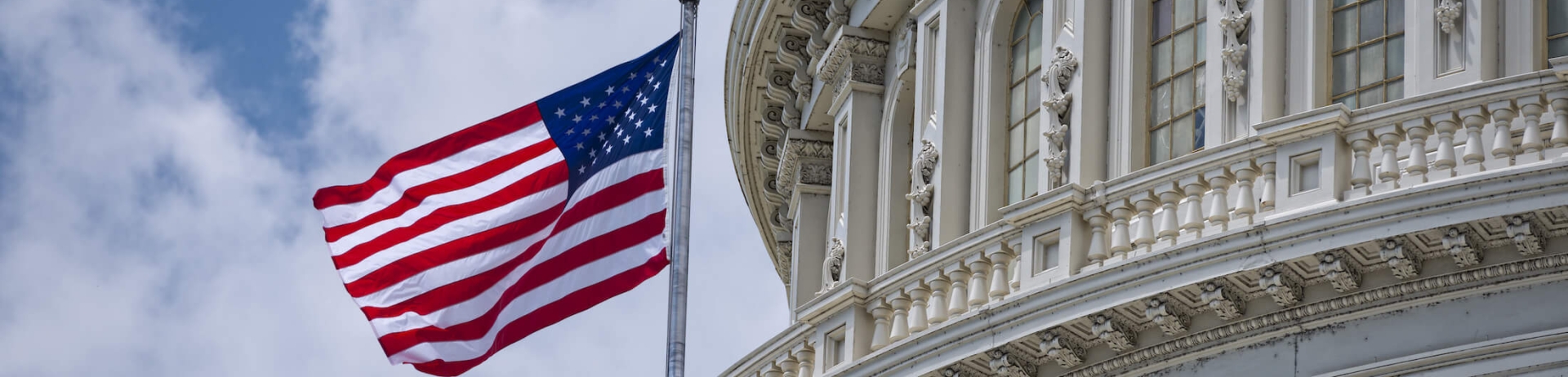 The Washington Capitol building and a US flag